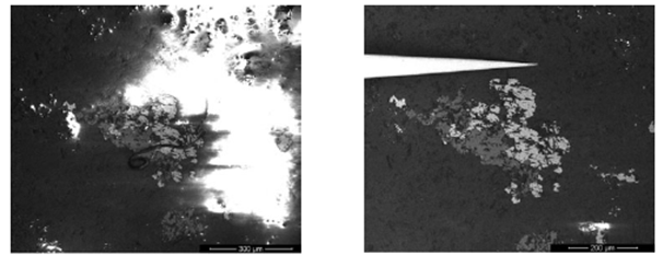 Imaging of non-conductive sample, showing how nanomanipulator can provide grounding connection and thereby improve image.