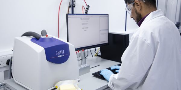 Photograph of MQC-R TD-NMR system with operator