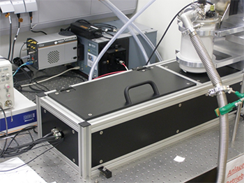  Image of the measurement setup showing the spectrograph and ICCD camera in the background